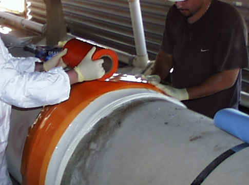 Bell & Spigot Joint Wrapped in Orange Film while curing